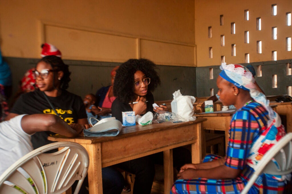 Ruth Zeto working in Ghana with female head porters