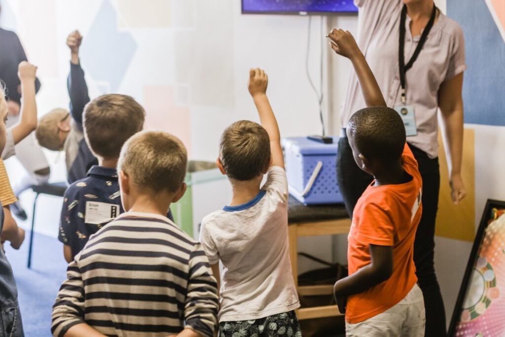 Kids participating in a movement break in the classroom