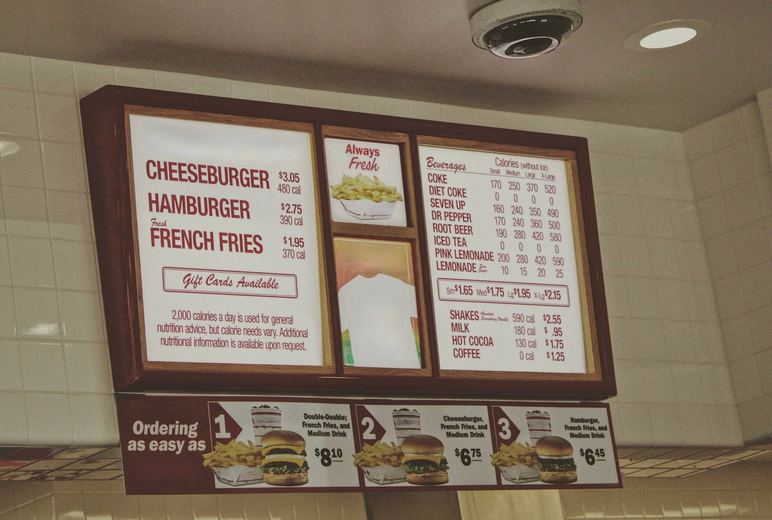 Menu board in a fast food restaurant with calories labeled