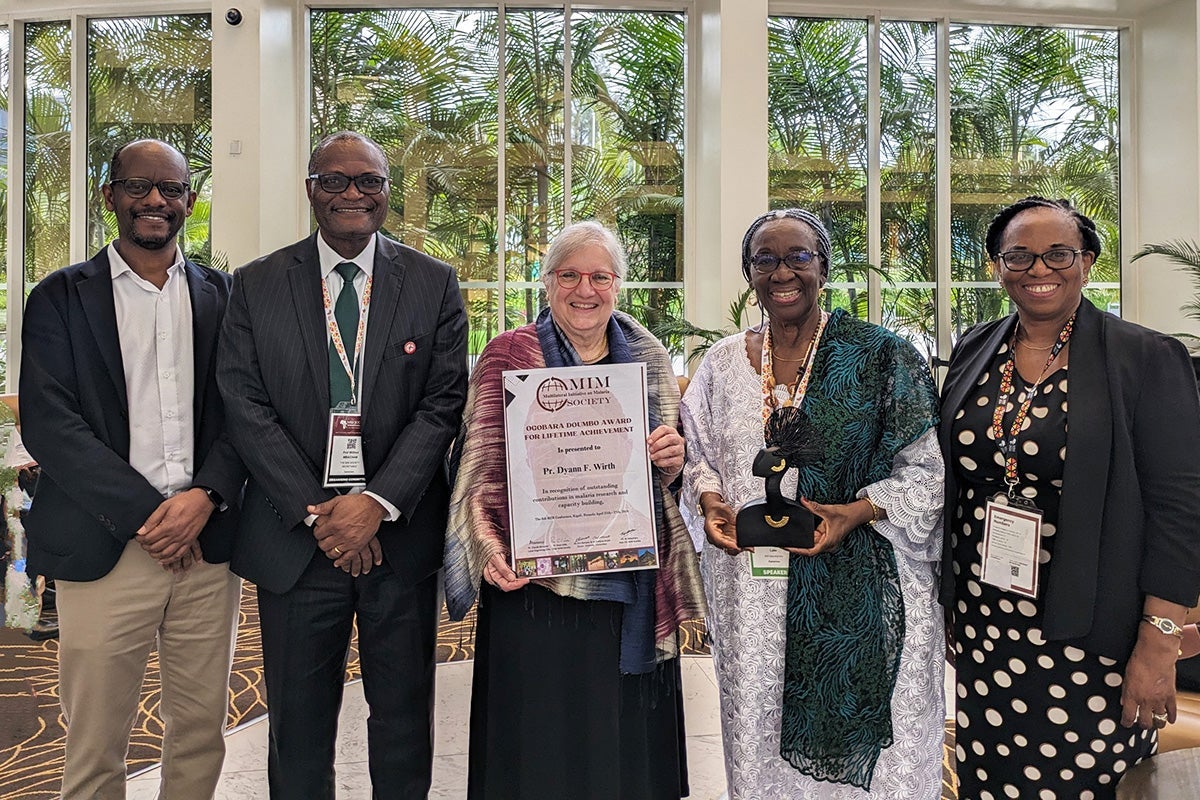 Abdisalan Noor (left) and Dyann Wirth (center) with MIM Society leaders Wilfred Mbacham, president at Fobang Institutes for Innovations in Science & Technology, Yaoundé, Cameroon (second from left), Rose Leke, chair, independent review committee at GAVI and co-chair of the Defeating Malaria Initiative at Harvard University (second from right), and Evelyn Ansah, director of the Centre for Malaria Research, University of Health and Allied Sciences, Ghana (right)