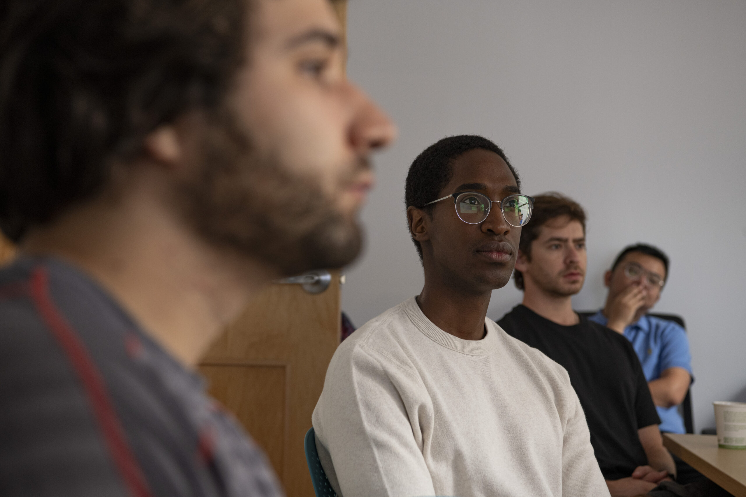 Four Rubin lab members participating in a lab meeting.