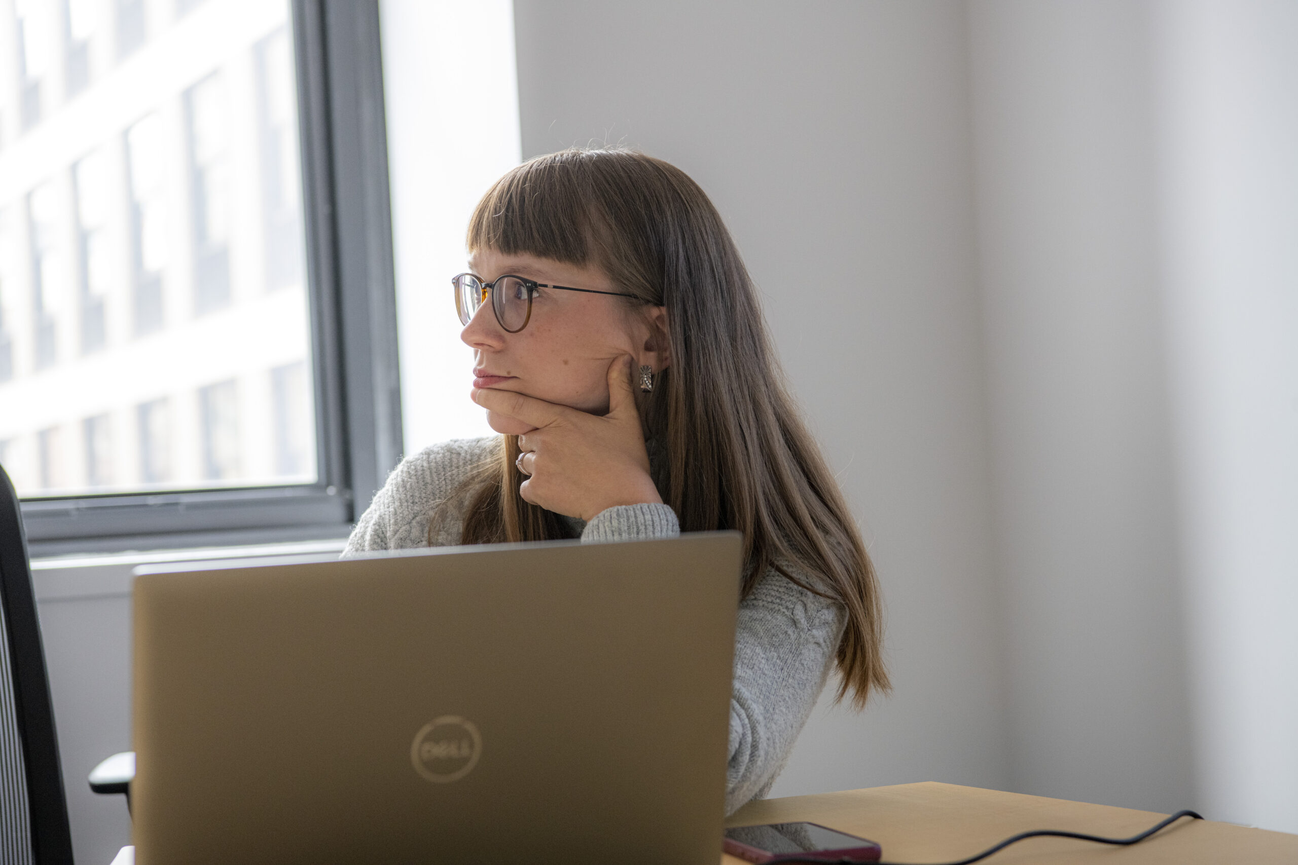 Rubin lab member listening during a lab meeting.