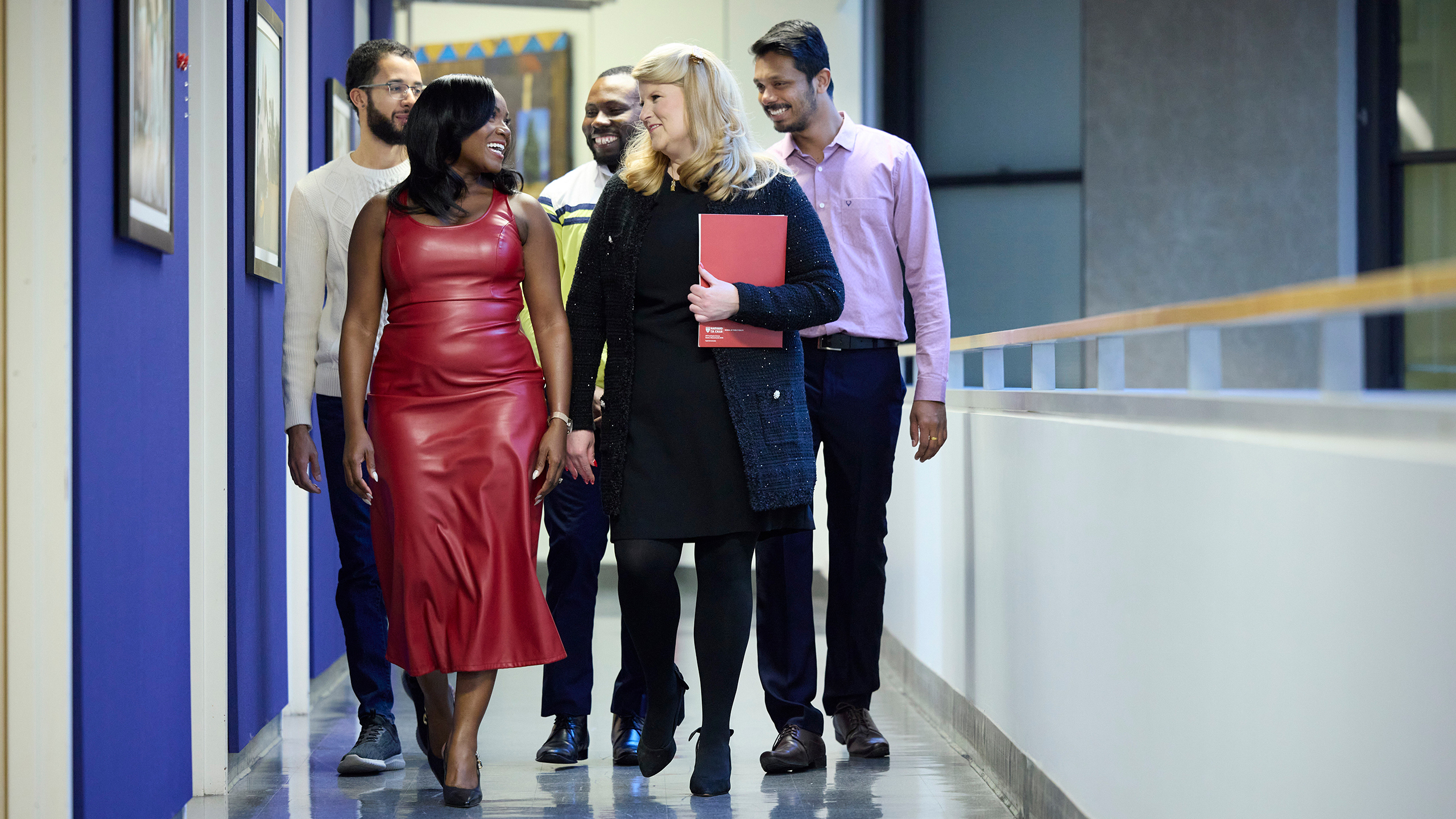 The Corbett Lab members walking in the hallway at the Chan School