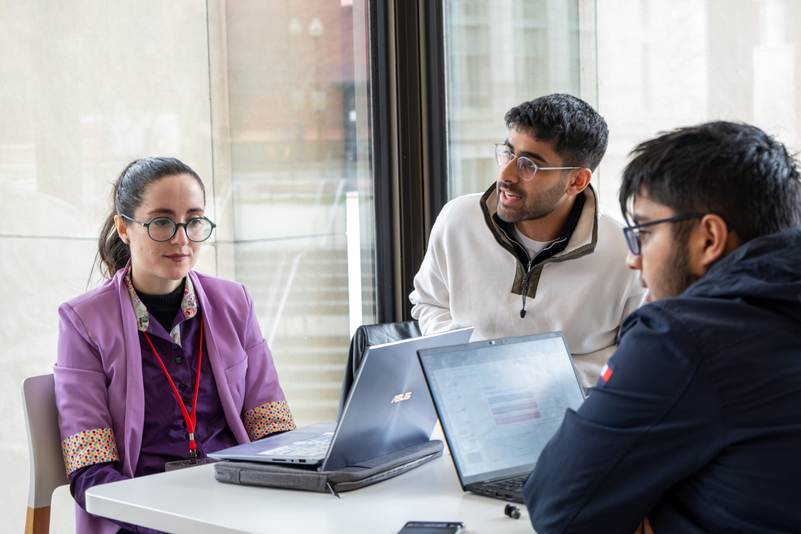 a group of HSIL students working as a group at a table