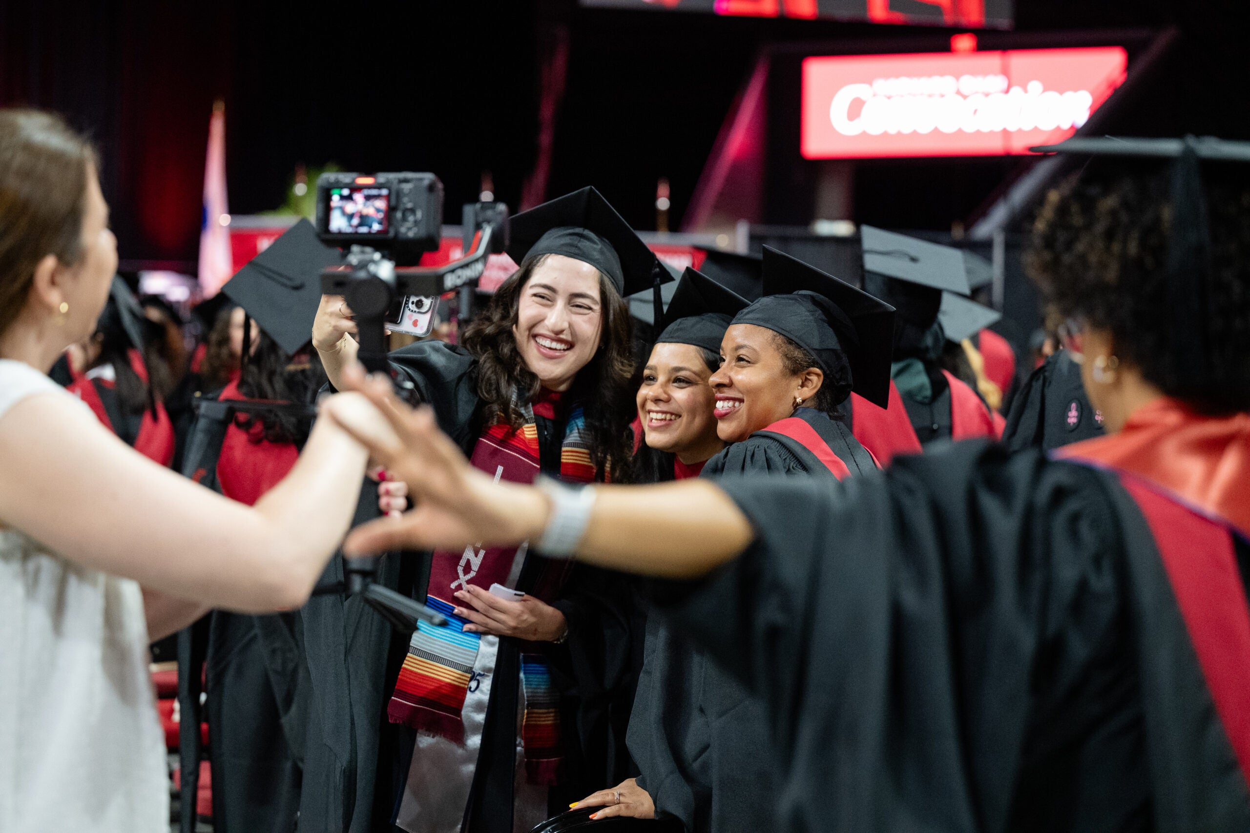 A group of MPH-Epidemiology students in caps and gowns smile for the camera at Convocation