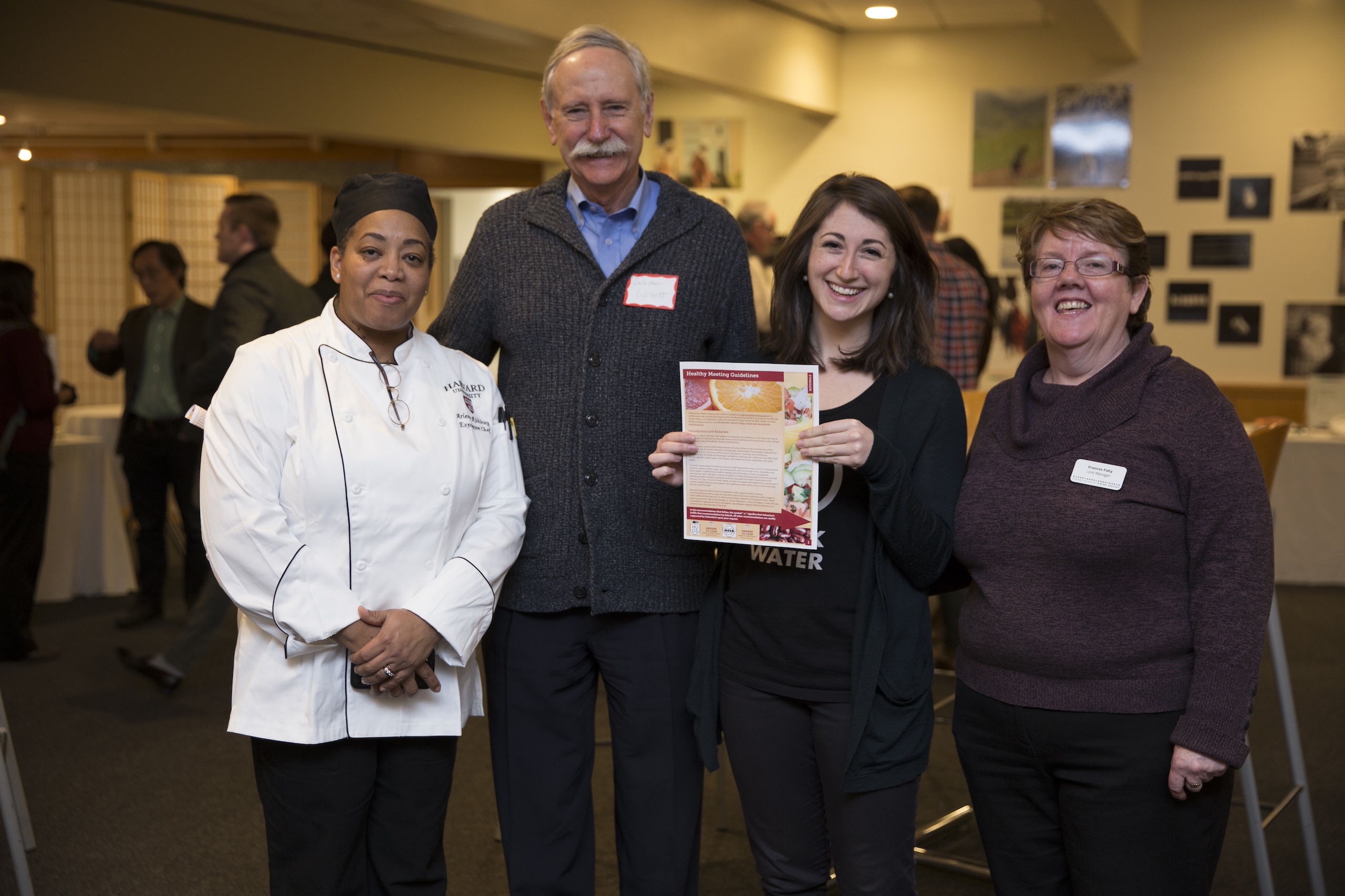 Aviva Musicus holds up a copy of healthy meeting guidelines with Harvard Chan food service