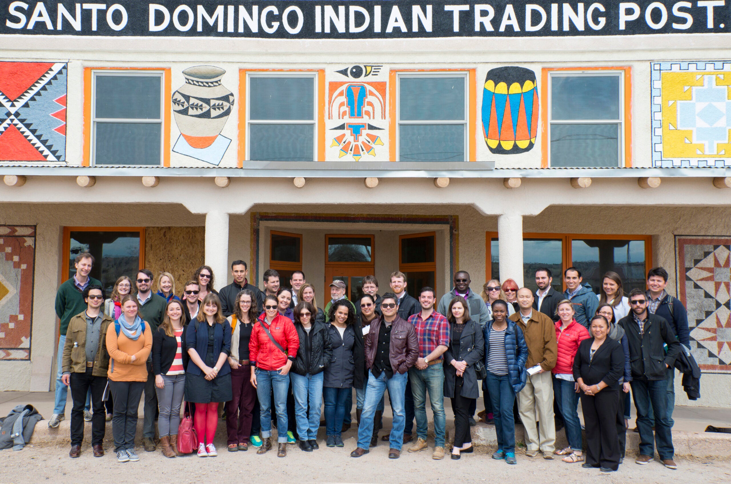 Cohort I Fellows with Rose Fellows during a site visit at Santo Domingo Pueblo, standing together in a scenic setting