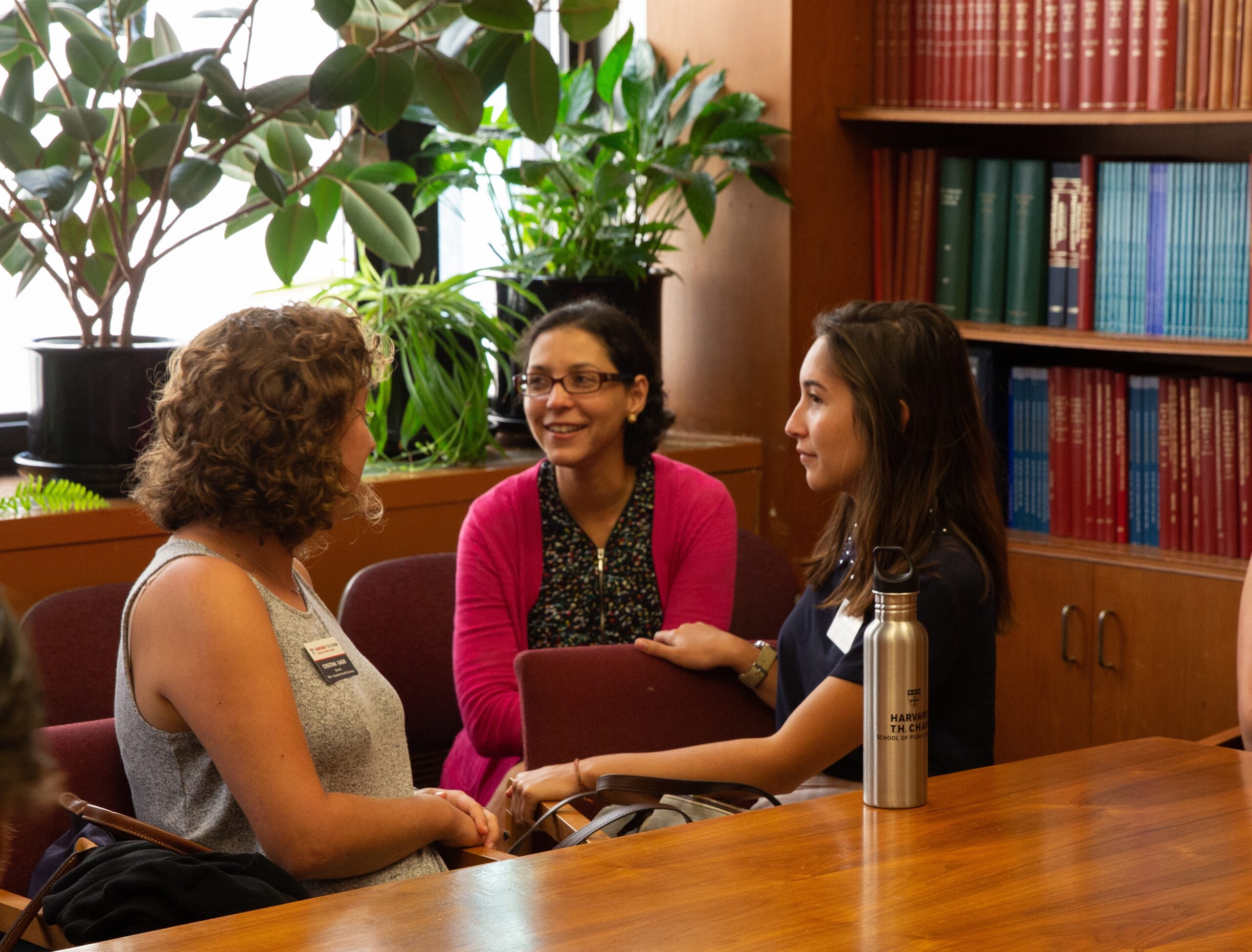 a group of doctoral students meet with Josiemer Mattei