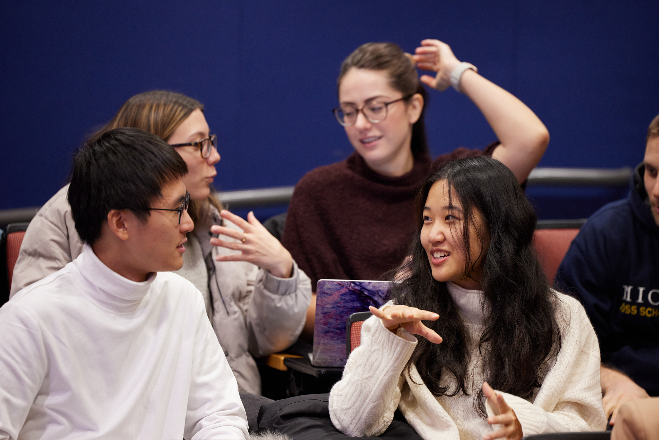 Students at the Chan School of Public Health chatting in classroom