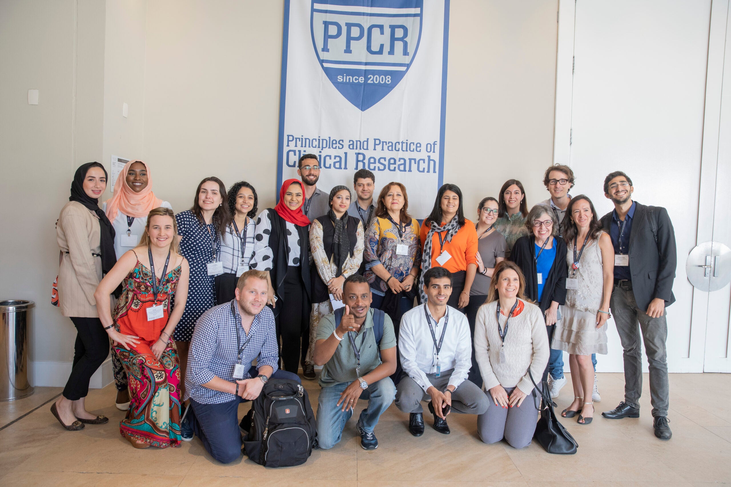 Group photo of PPCR students standing in front of a PPCR banner