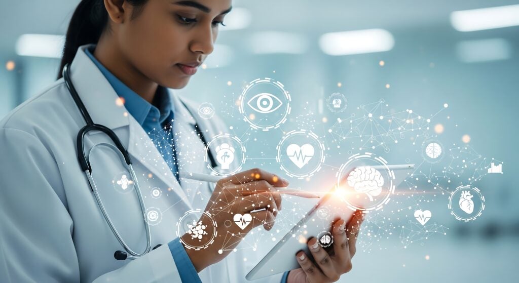 Doctor using tablet with health icons