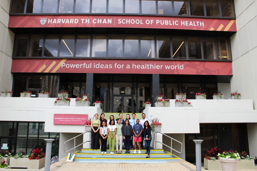 Summer 2024 interns pose on steps of Kresge building