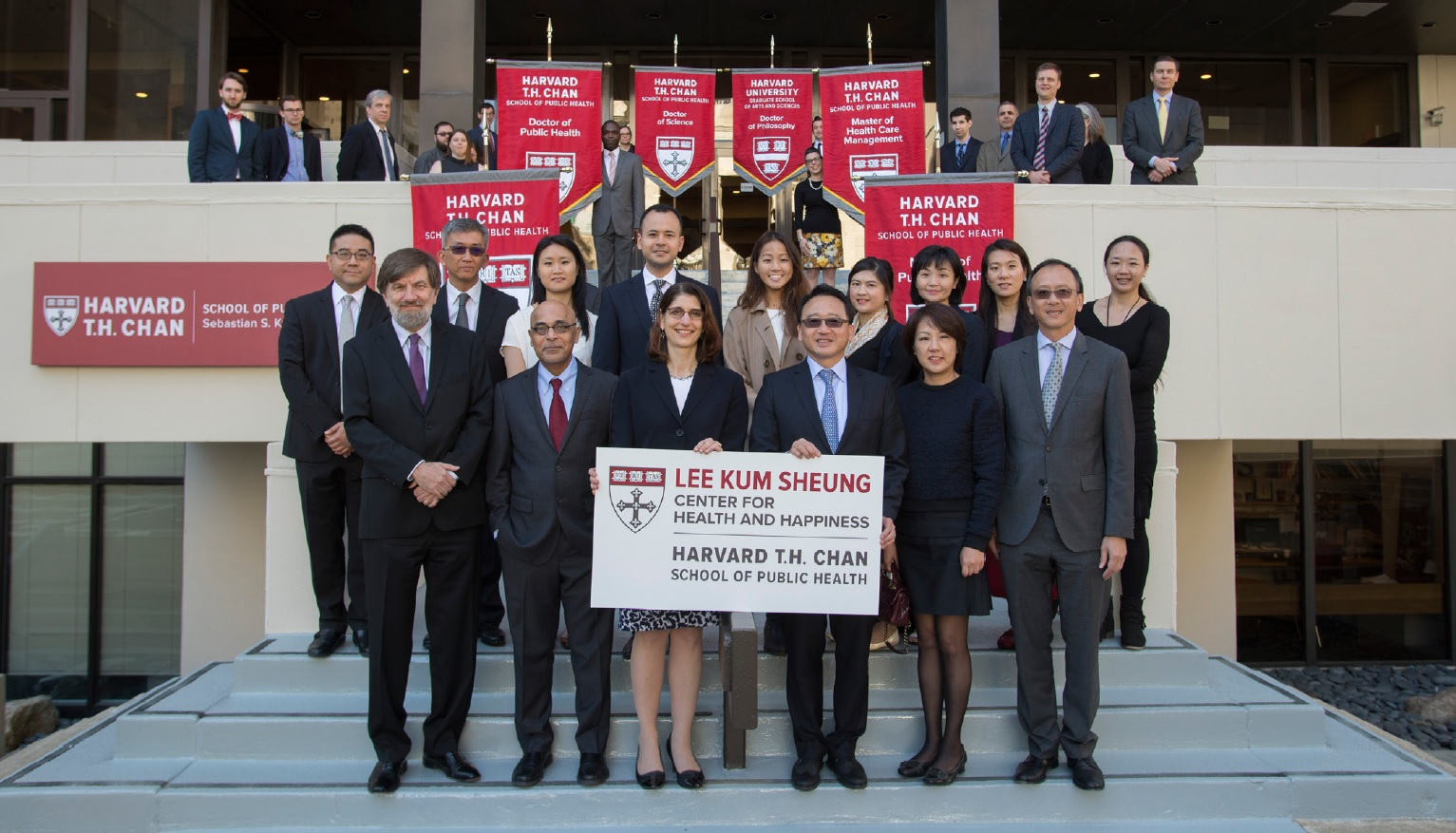 Lee Family on Kresge Building steps with Harvard Chan faculty and staff