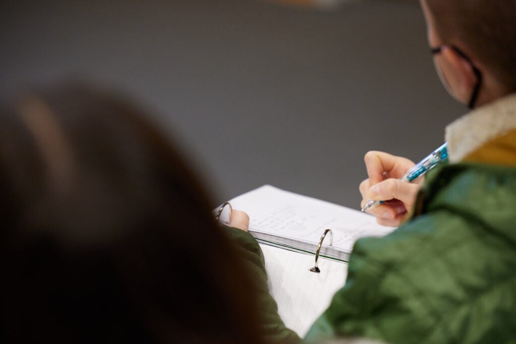 Researchers from the department of biostatistics taking notes