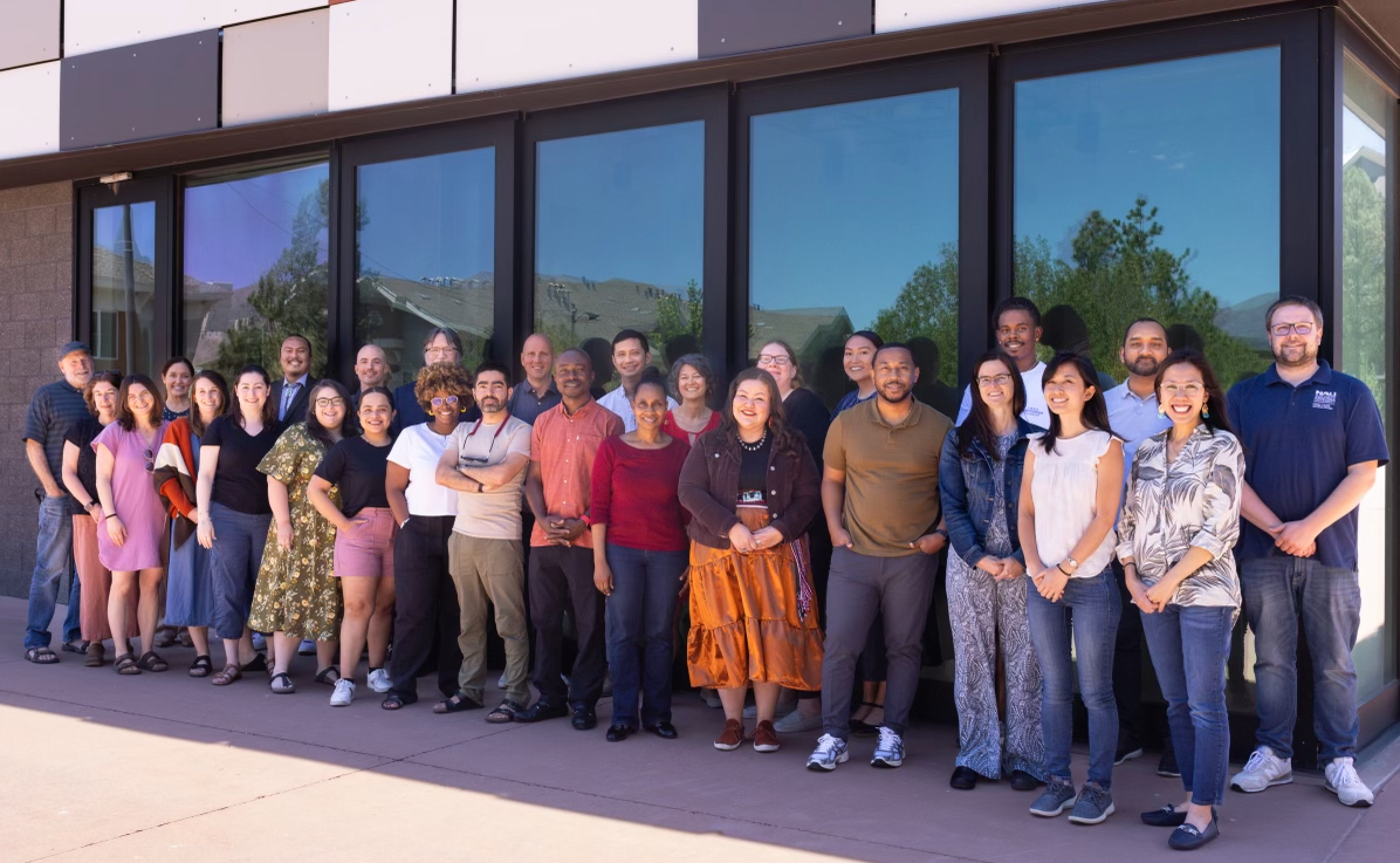 Cohort III Fellows gathered outside a building in Flagstaff, AZ, during a workshop.