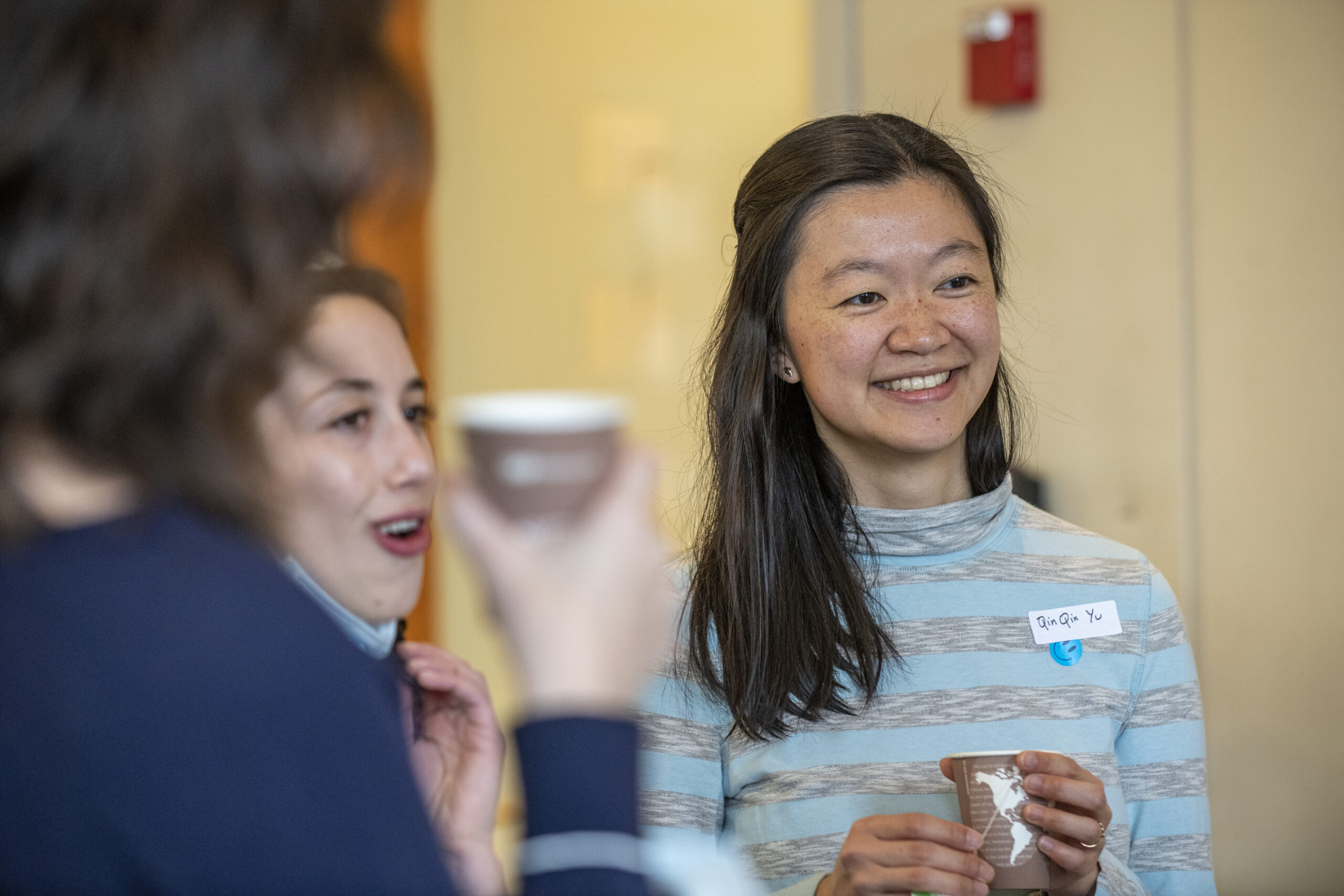 Lab members talking during the IID scientific retreat.