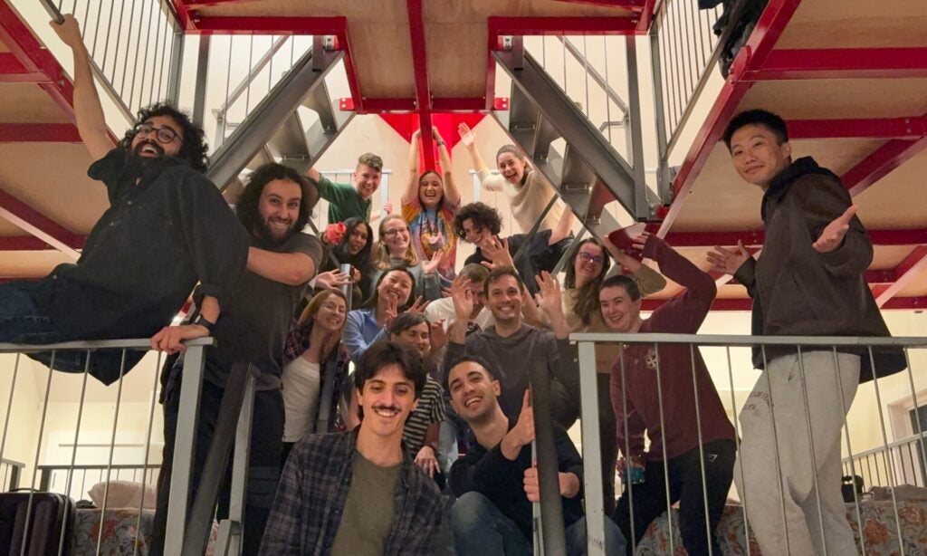 Catteruccia Lab group photo. Lab members on a staircase during a lab retreat.