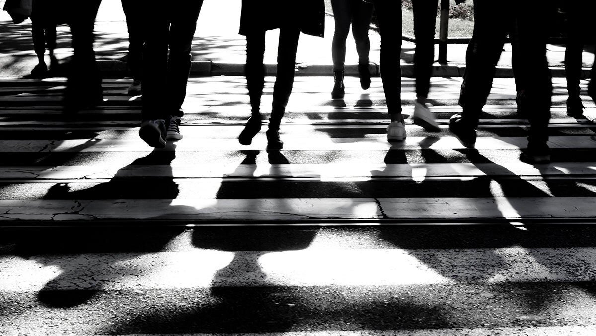 People cross a road.