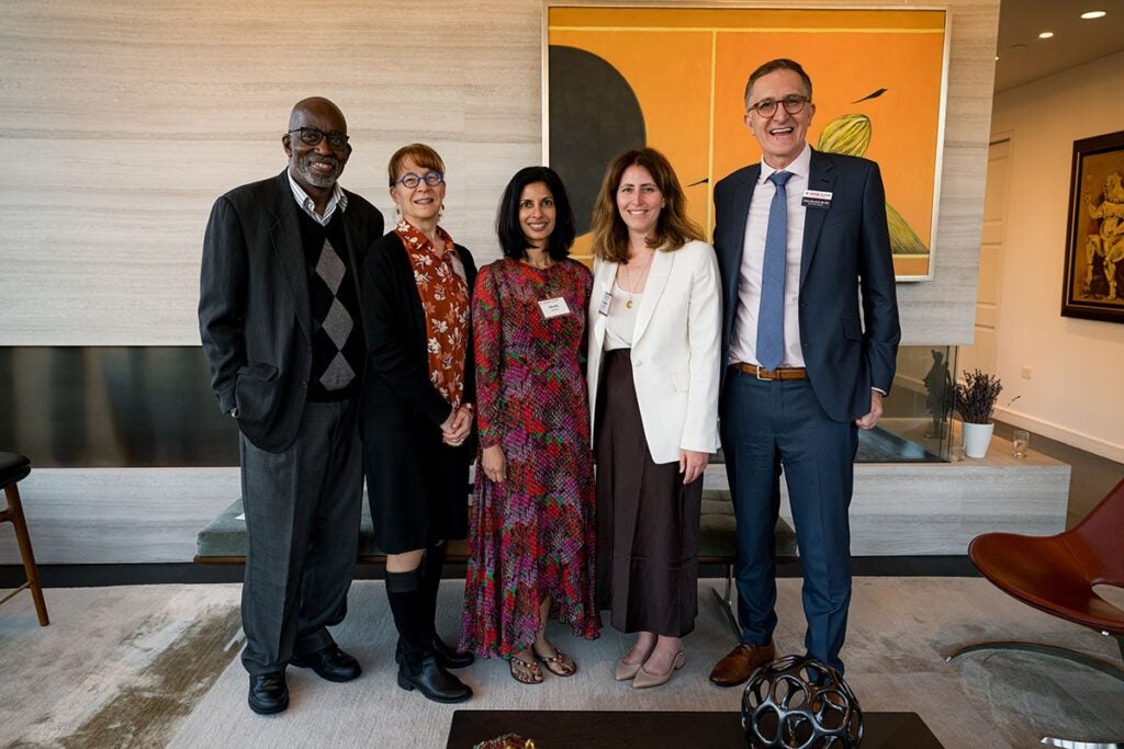 World Mental Health Day panelists David Williams, Bryn Austin, Amana Yarnell, posing with Dean Williams and host Sheila Sarma in the middle. 