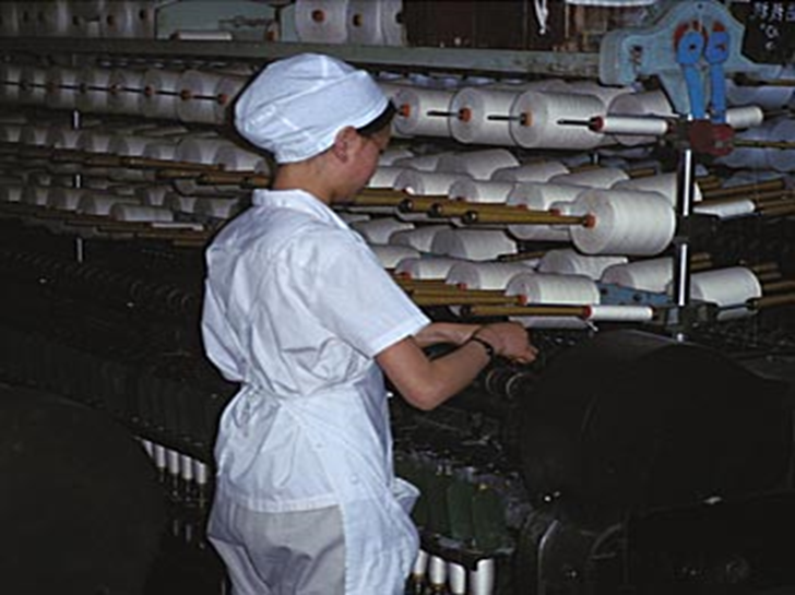 Workers in the later stages of textile manufacturing, such as the woman shown here spinning, have a lower exposure to dust. 