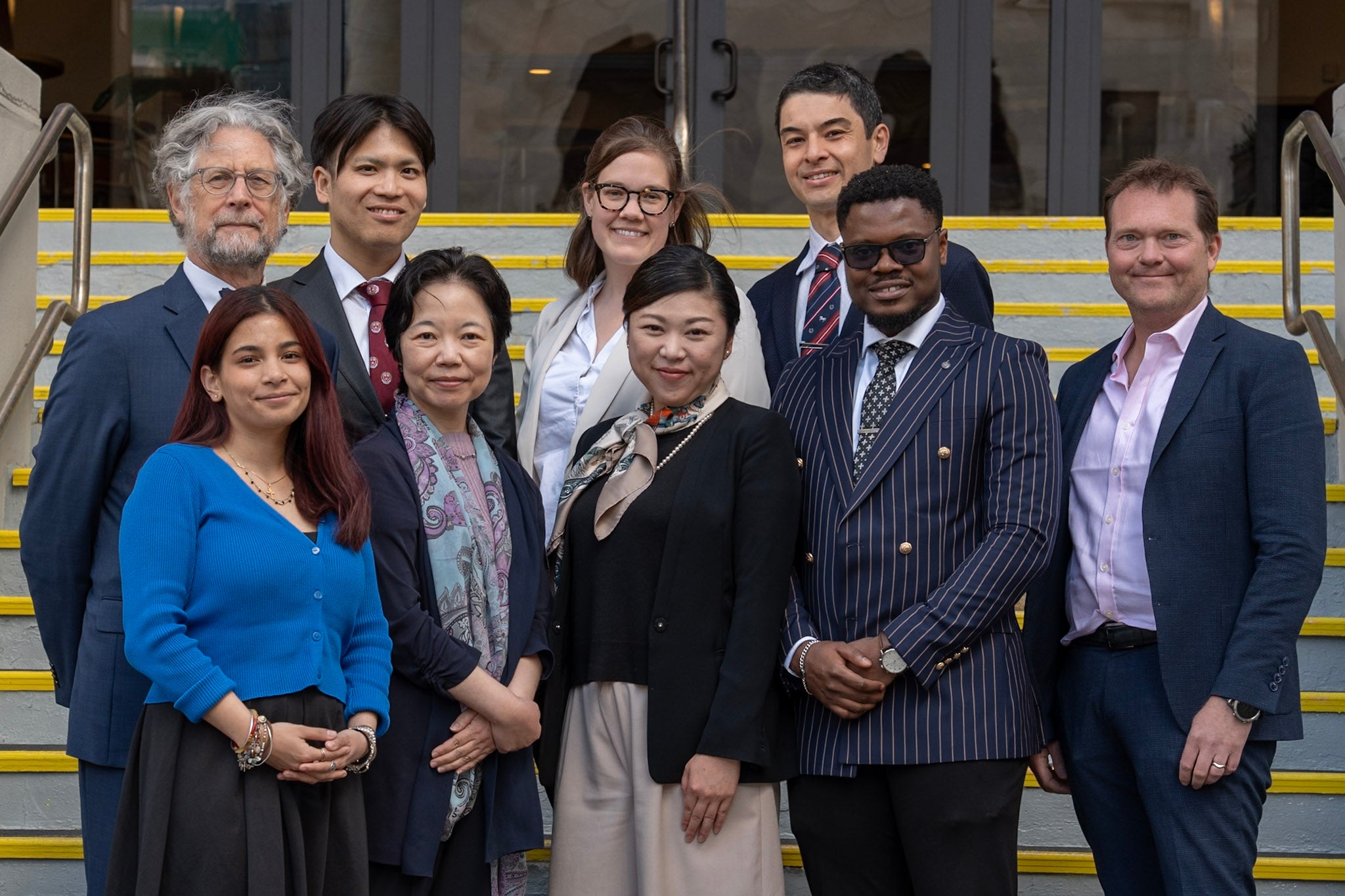 Takemi Program 2025–2026 cohort and program team standing on the steps outside a building.