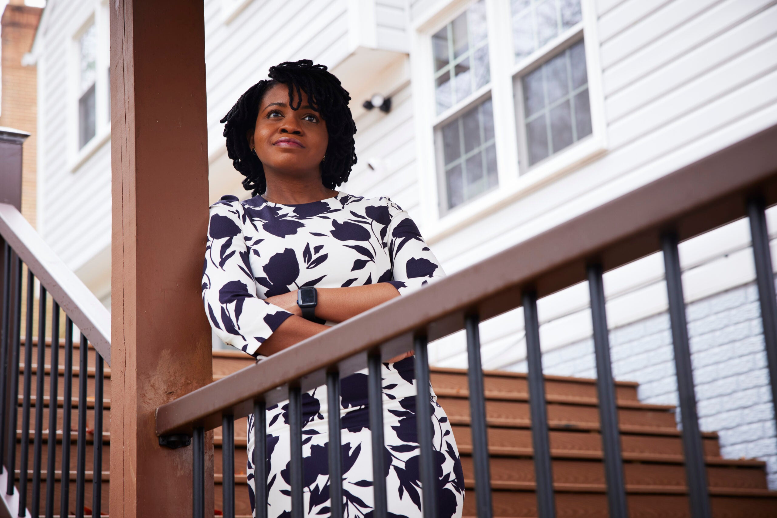 Anuoluwa Ishola poses on the landing of a staircase