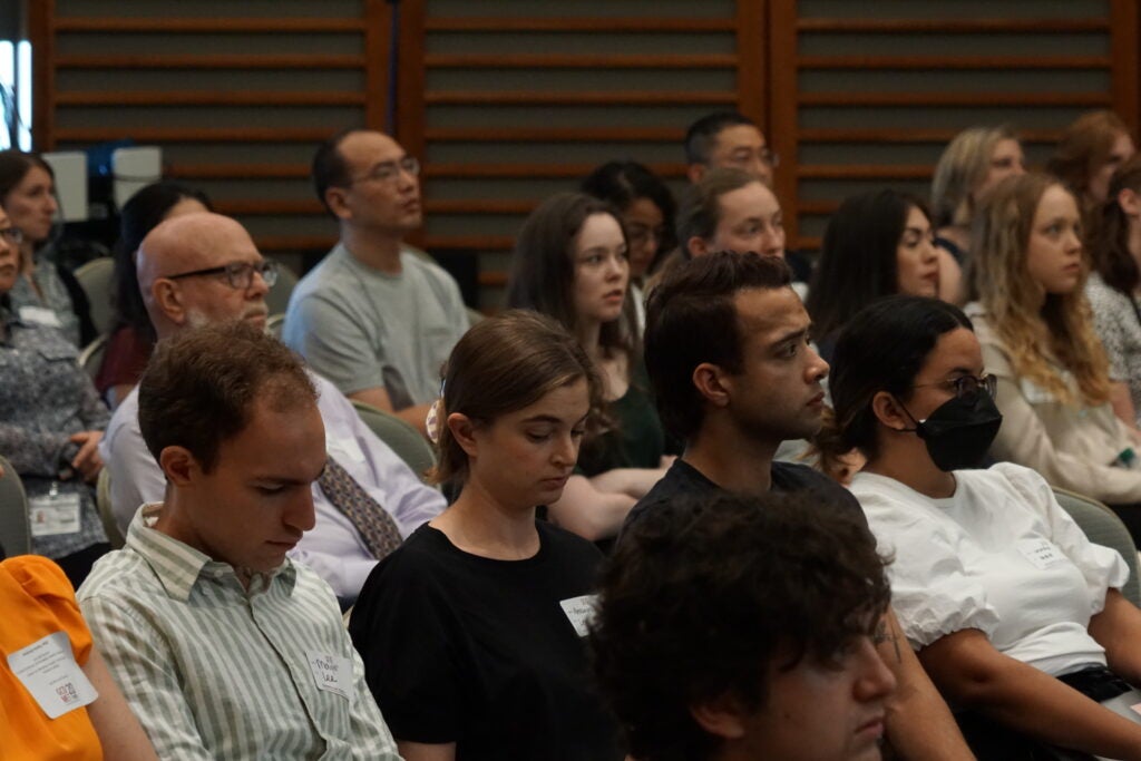 Trainees listen during 20th anniversary Symposium
