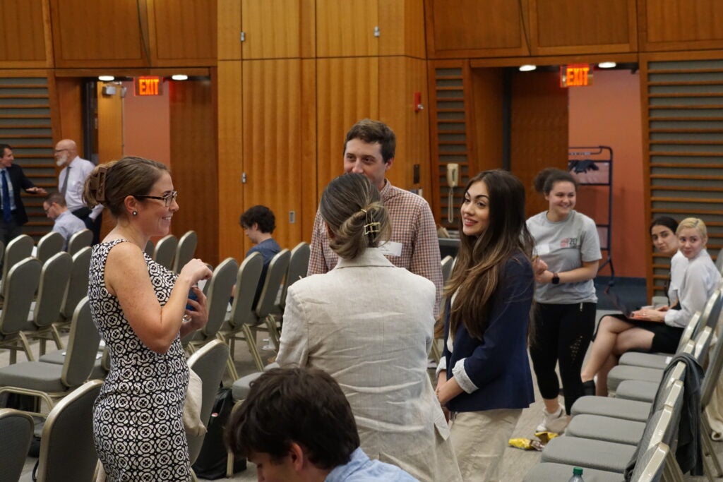 Trainees and PI's discuss the symposium
