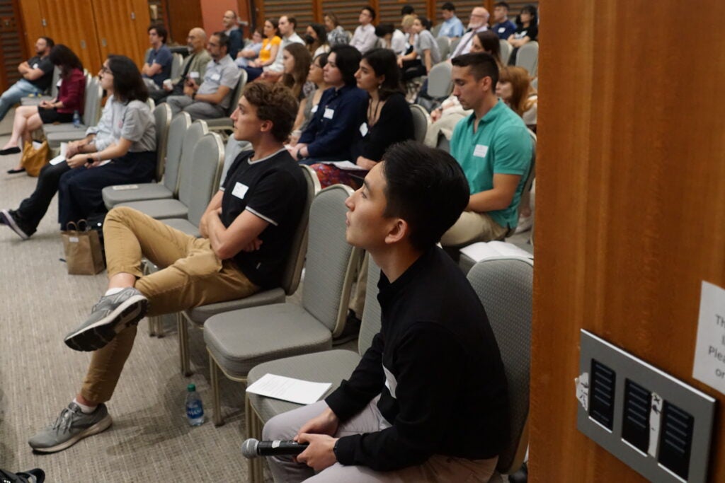 Trainees listening during symposium presentations
