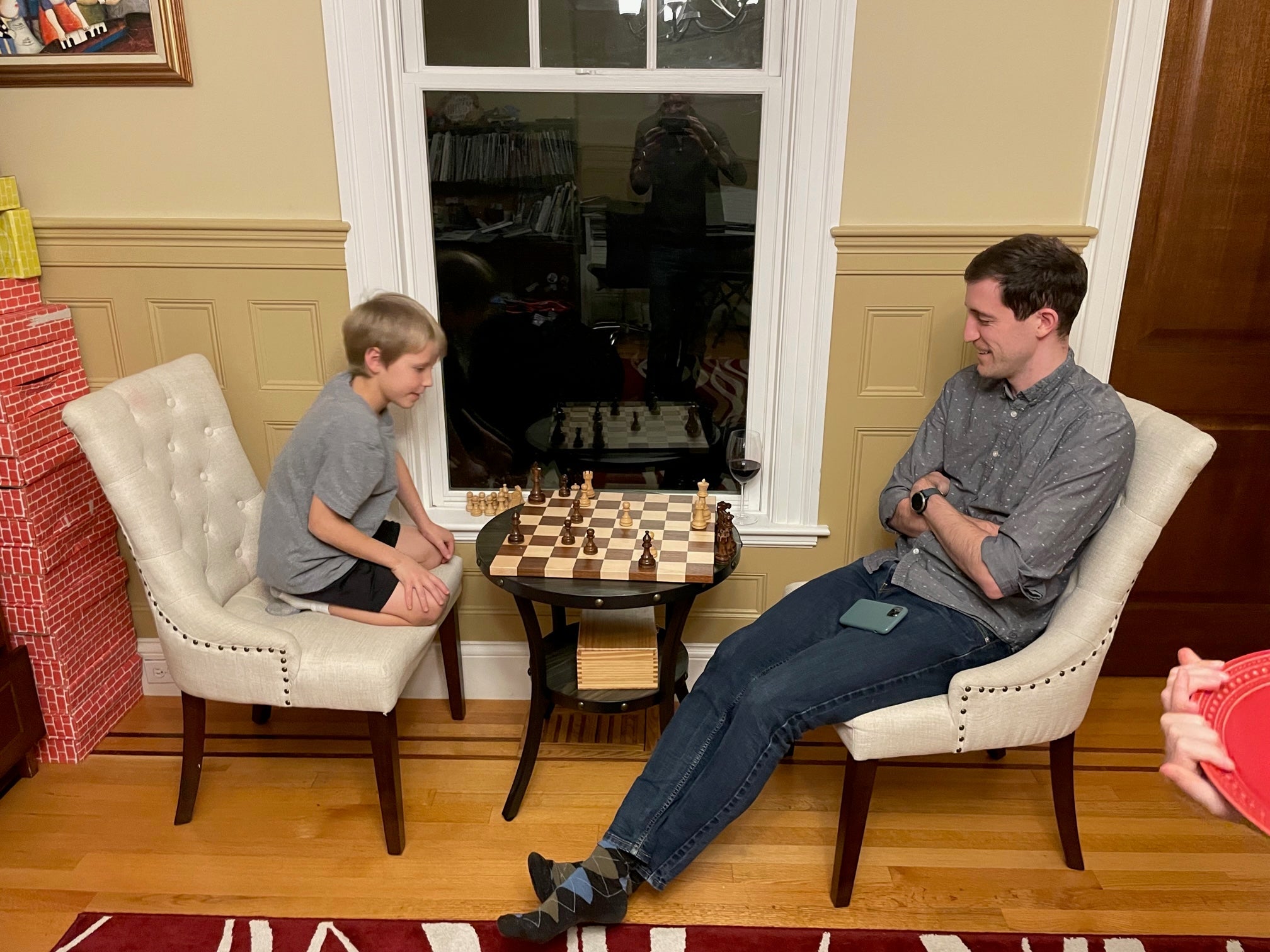 Zintis challenging a future lab member to a high-intensity chess match.