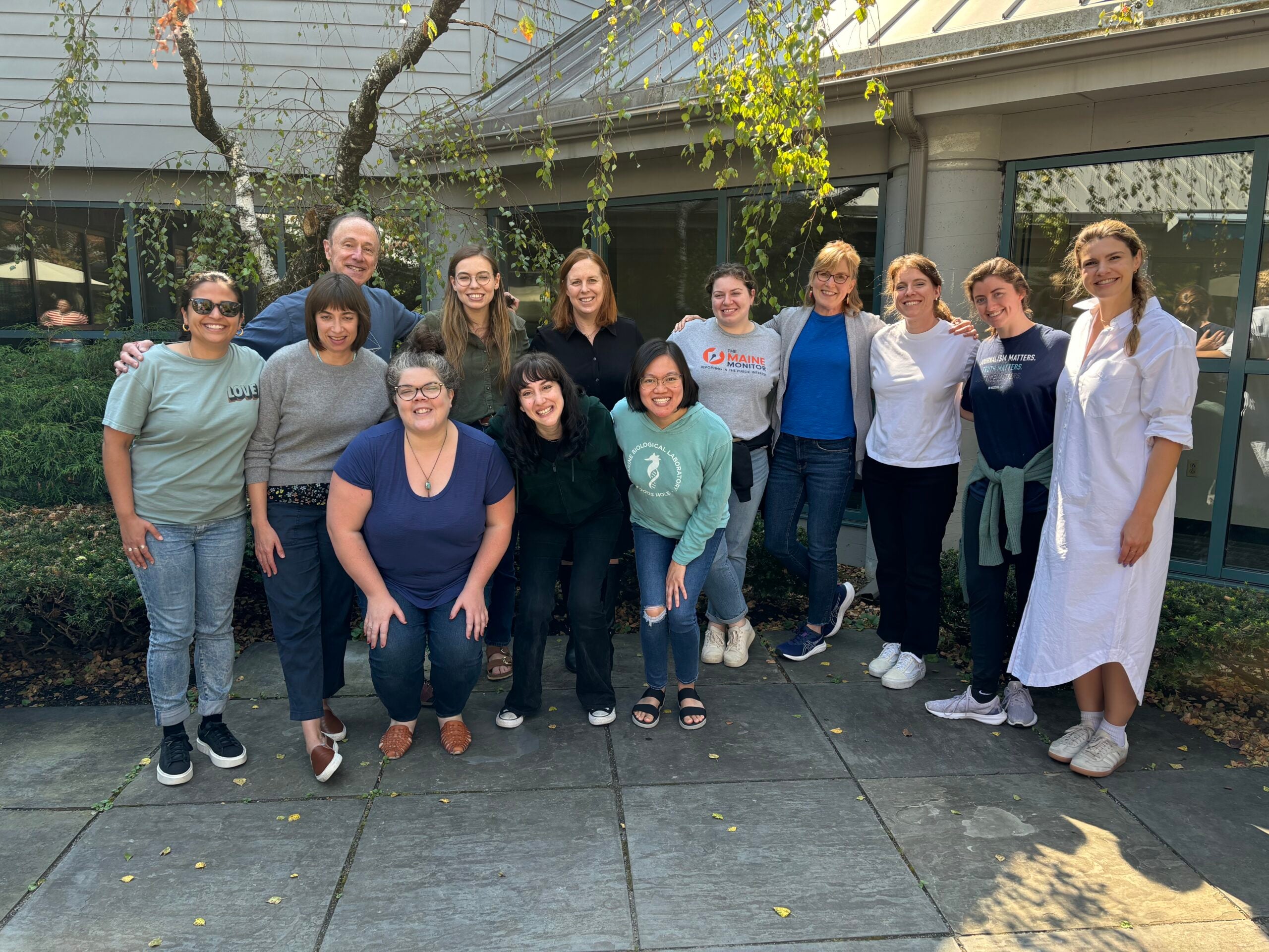 The 2024 Health Coverage Fellowship cohort pose together ina. group.