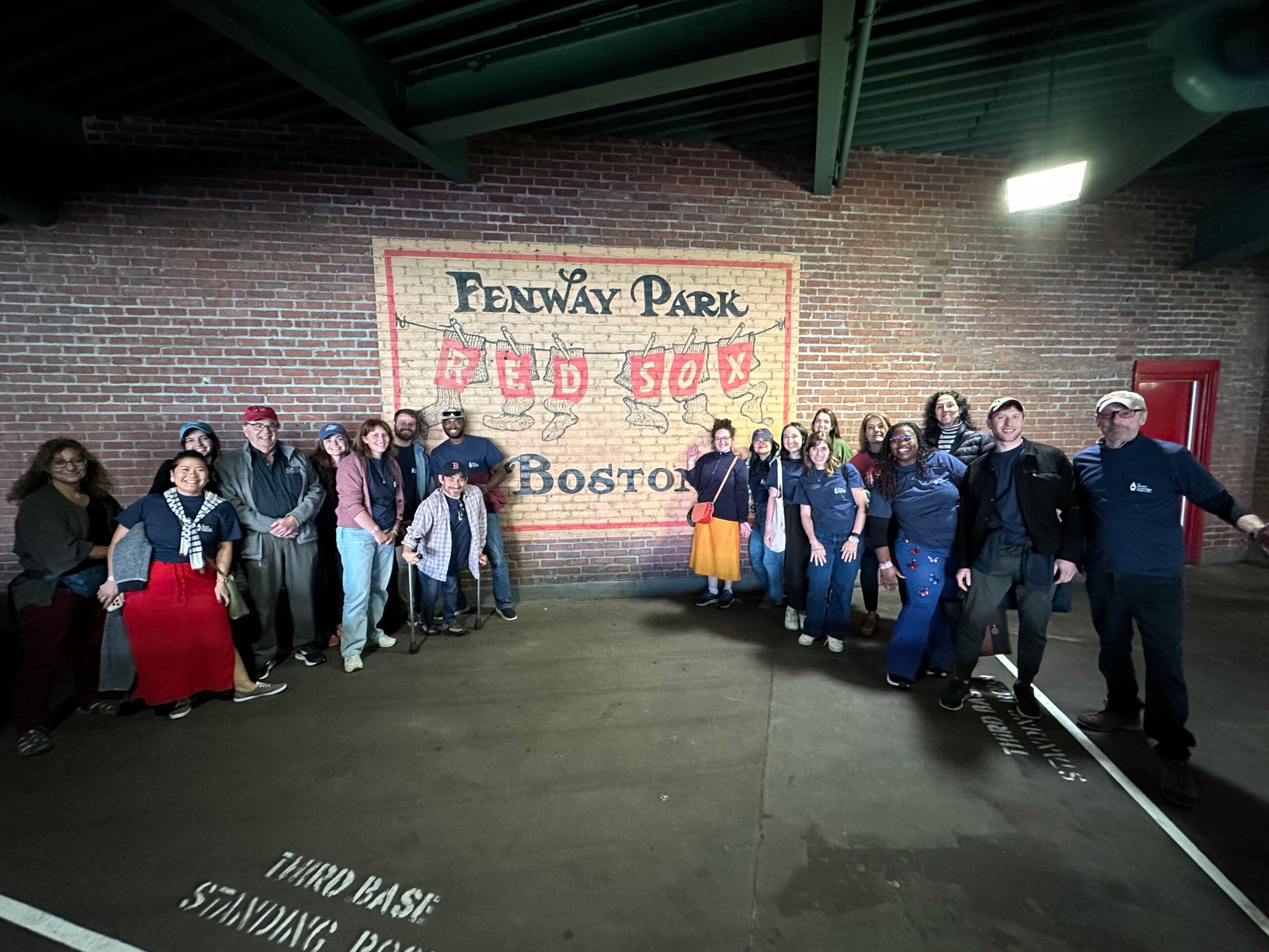 Participants in the 2025 Health Coverage Fellowship pictured at Fenway stadium.