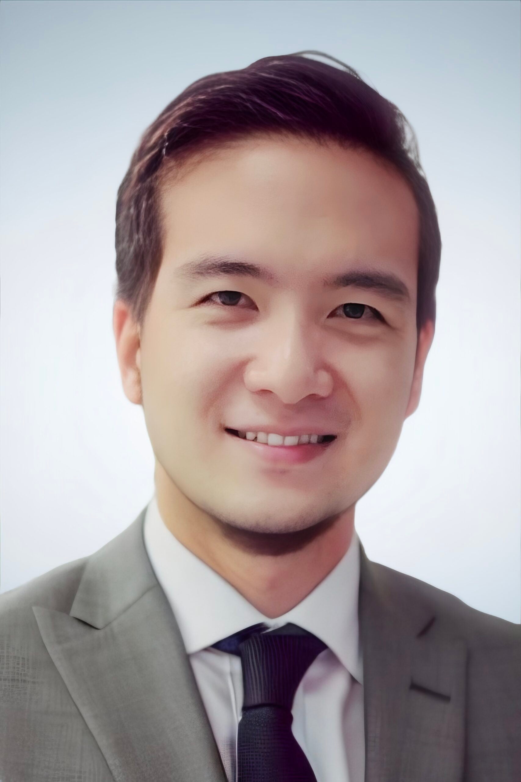 Justin Yang, man in suit, smiling