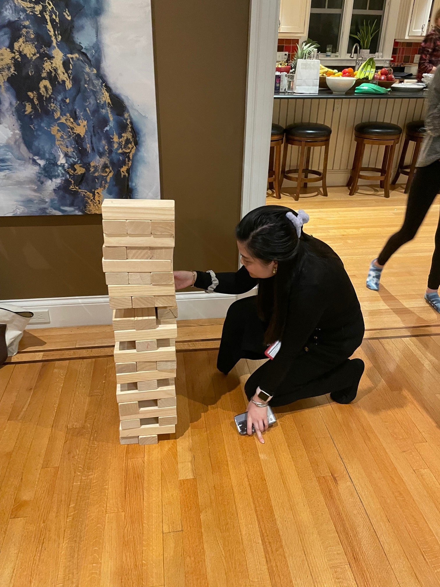 Kiwi starting the Jenga game.