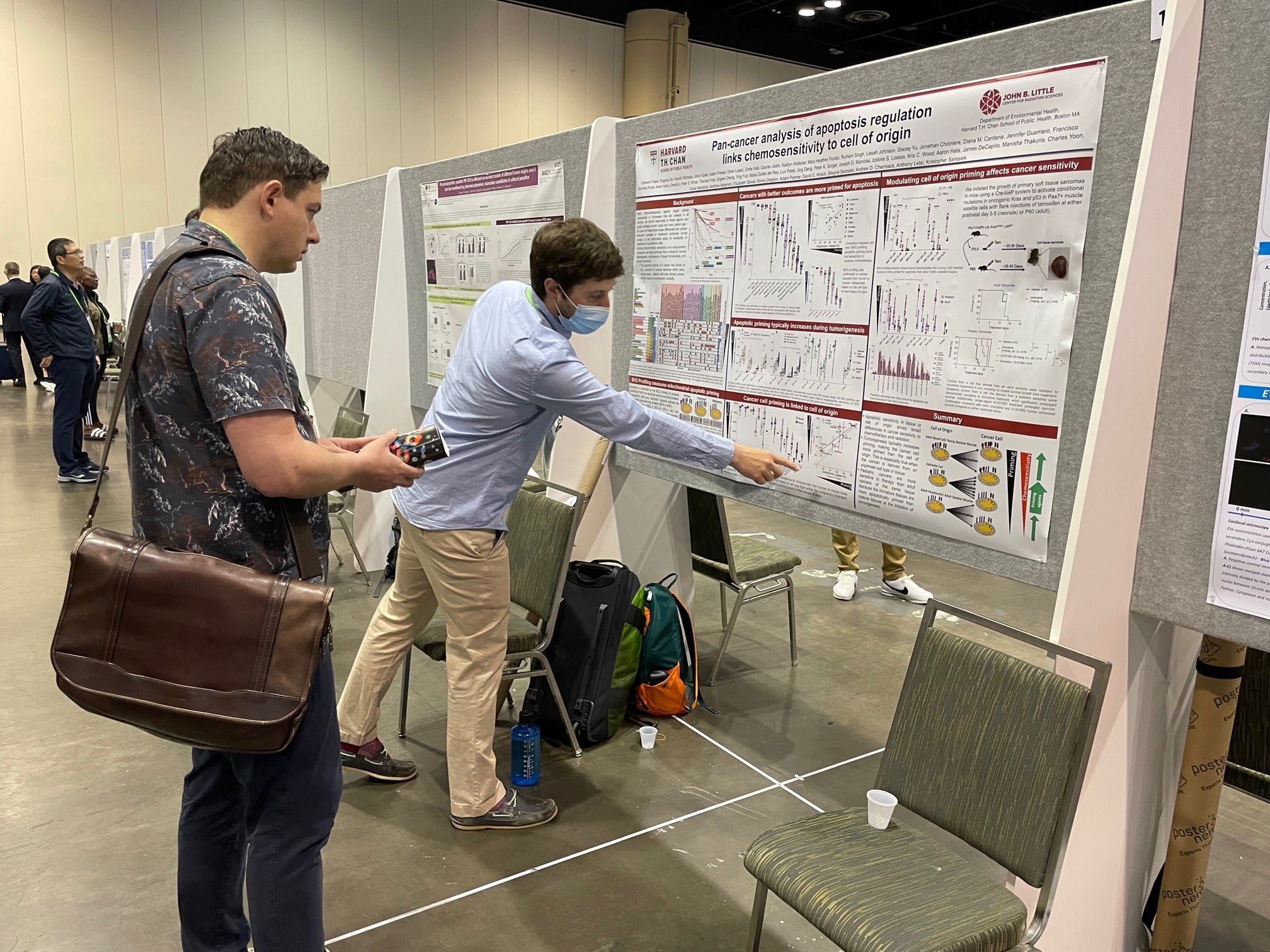 Cam presenting his poster at AACR 2023