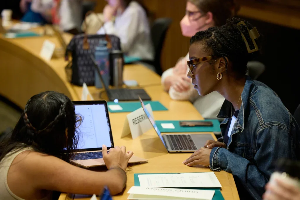 Marshae Nickelberry (right) works with an EJ Boot Camp participant. 