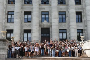 Youth Climate Summit participants pose on the steps of Harvard Medical School's Gordon Hall