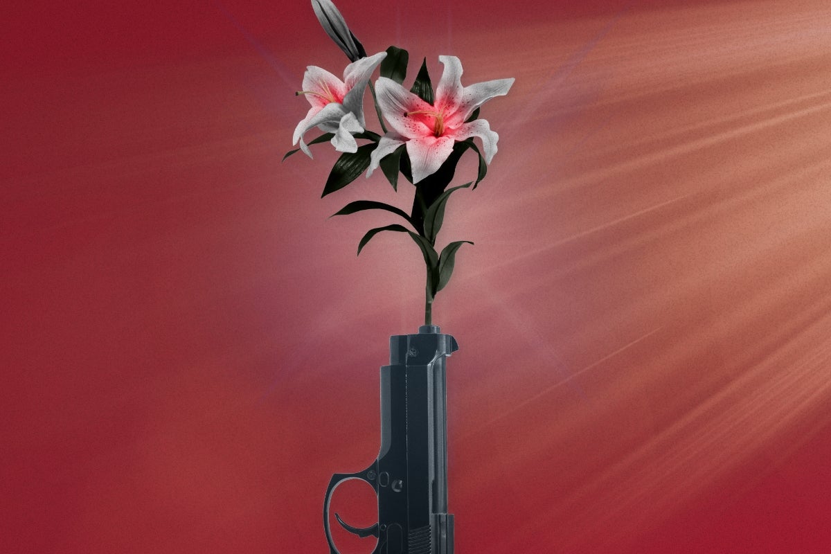 A barrel ofa gun with flowers shooting out of it