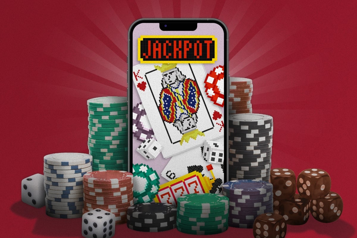 A cell phone screen with the word "Jackpot" and playing cards, surrounded by poker chips and dice