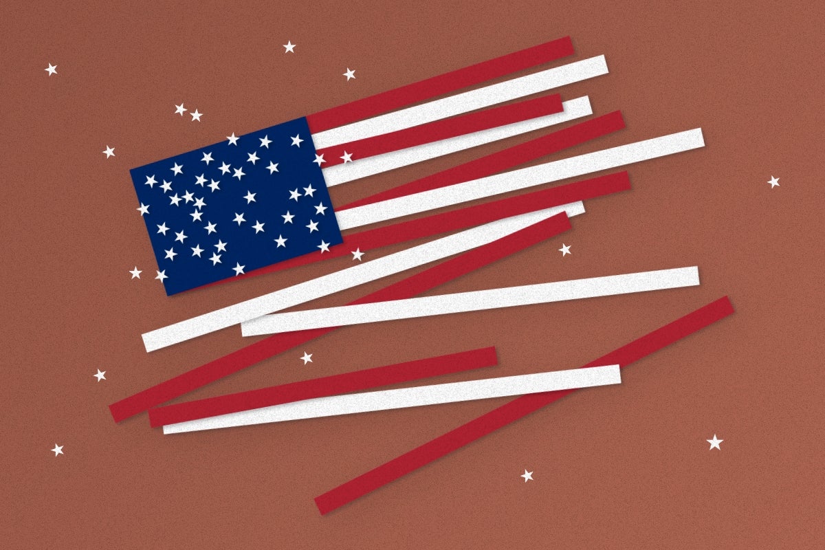 American flag with the stars and stripes falling apart