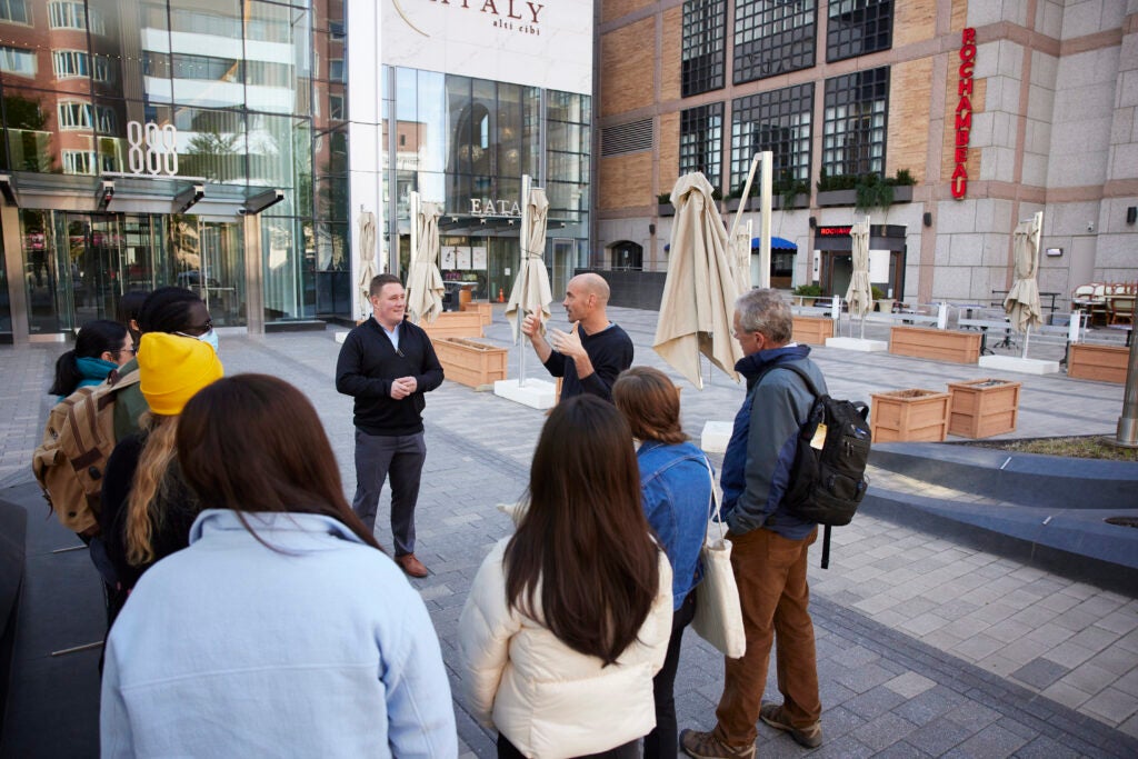 Joe Allen talks with students outside of the Prudential Center in Boston.