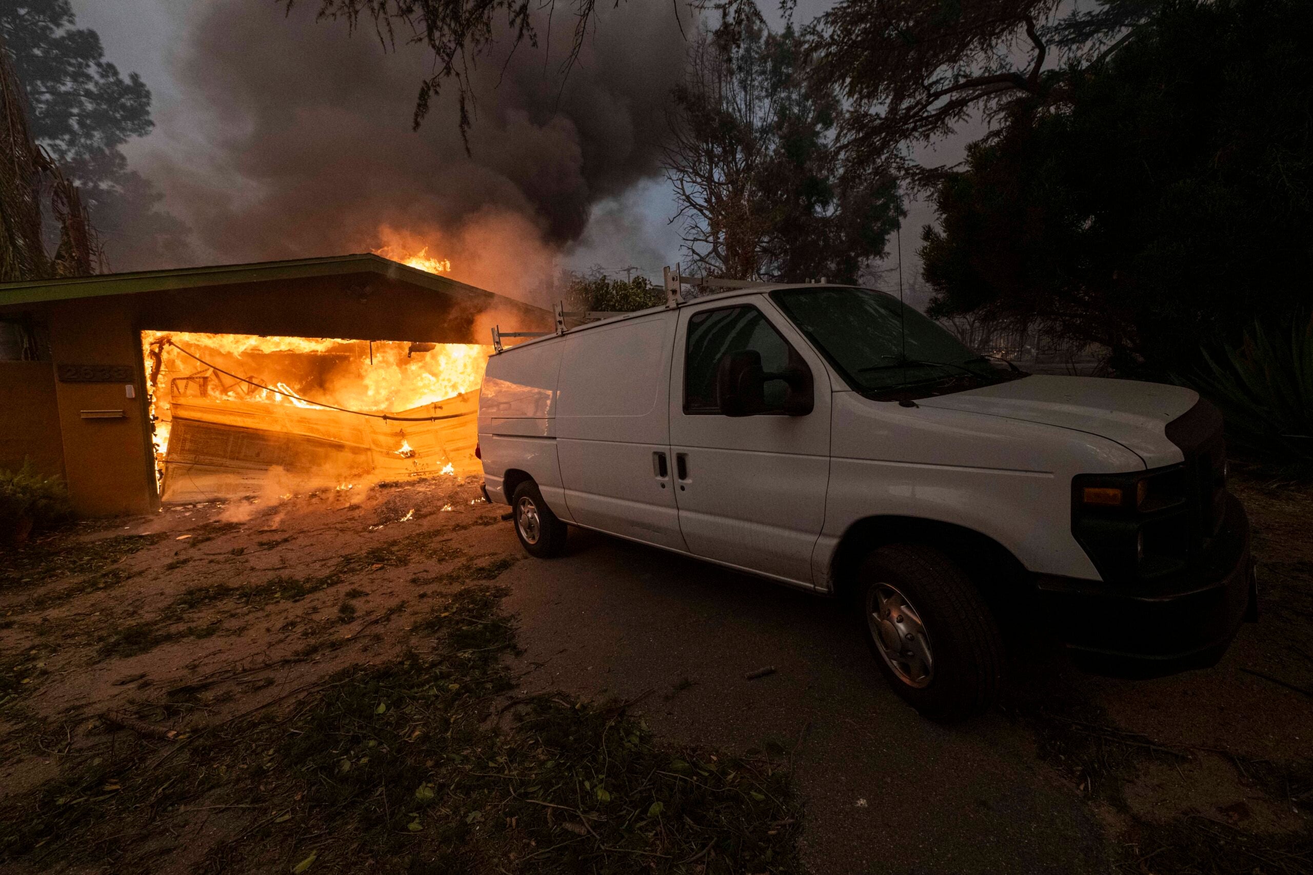 A residence garage seen on fire during 2025 Eaton fire in Altadena.