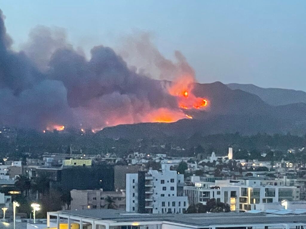 Photo of fire and smoke on the hills above Los Angeles.