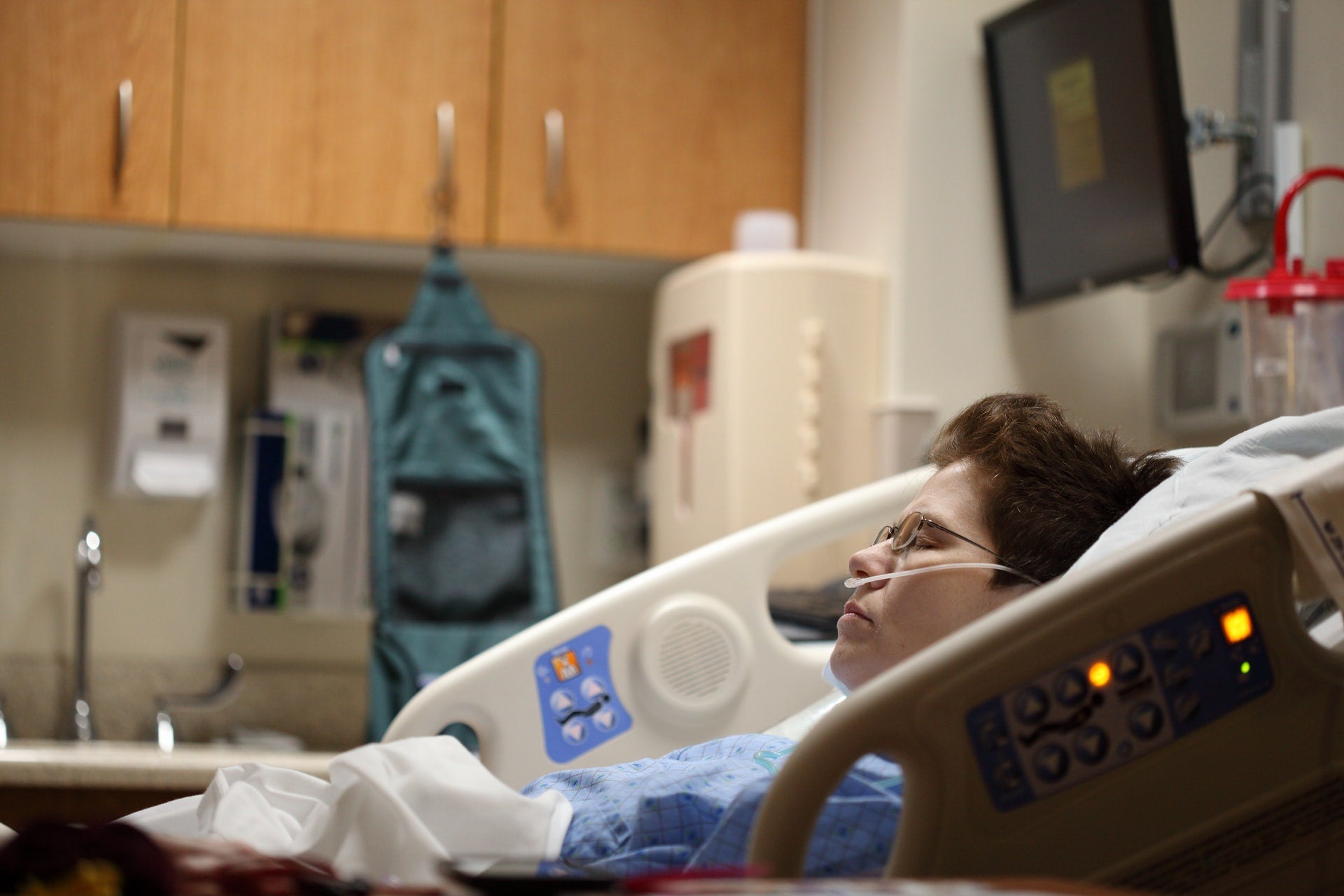 Woman lying in hospital bed