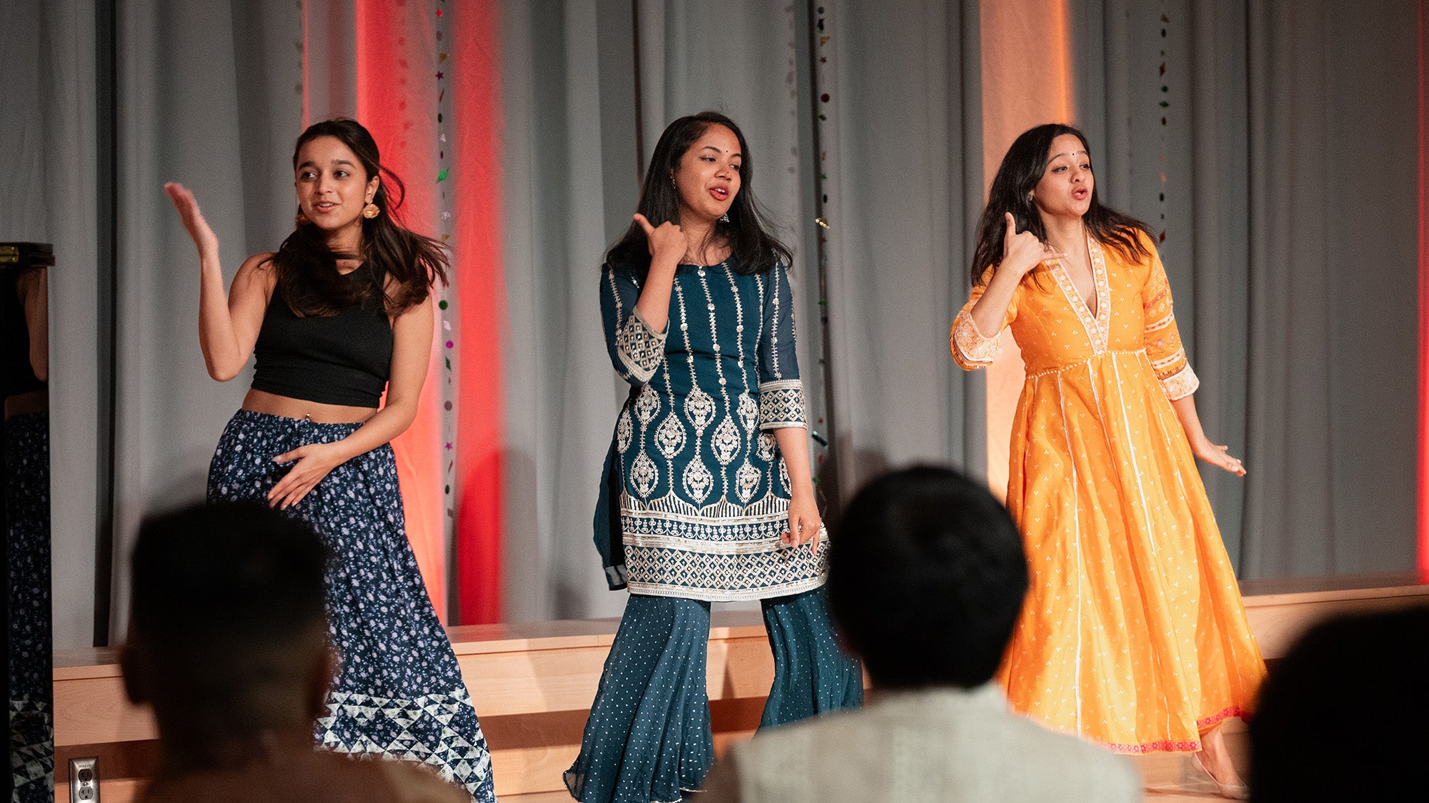 Students Anoushka Dhru, Rajeshwari Subramanian, and Smitha Viswanathan perform a Bollywood dance.