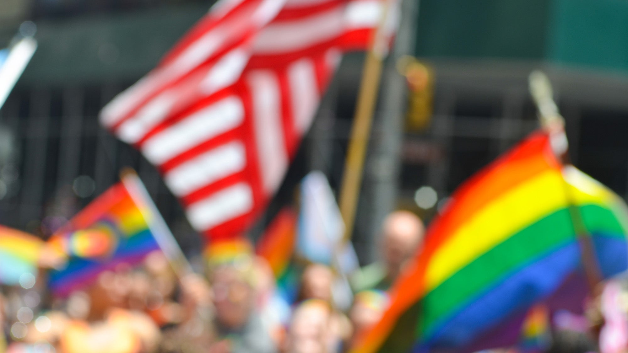 Pride and the US flag is seen in the background during the 54th Annual Pride Parade along 5th Avenue in New York City on June 25, 2023.