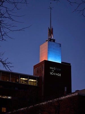 Museum of Science lit in blue and orange in recognition of World Cancer Week. Photo: Kent Dayton.