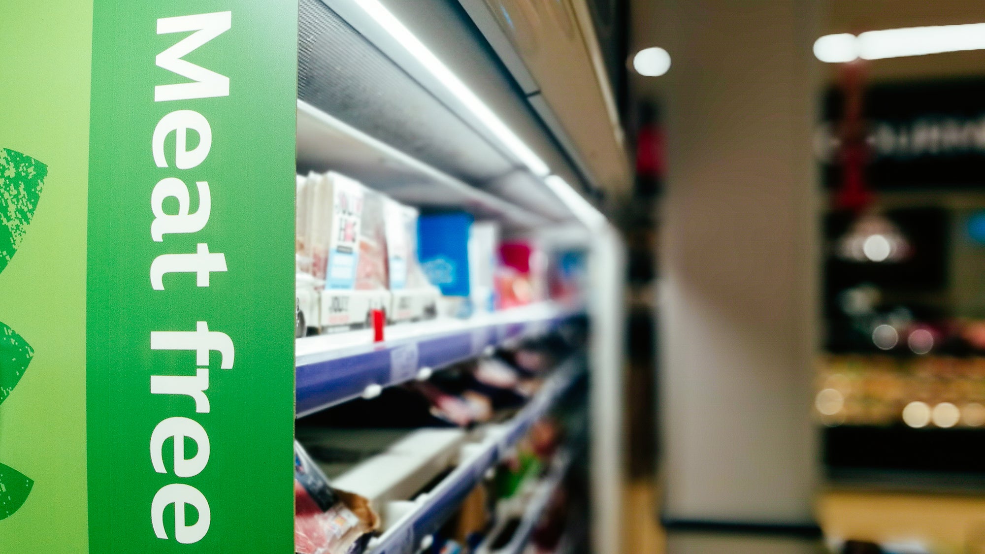 Sign in a supermarket aisle with the words meat free.