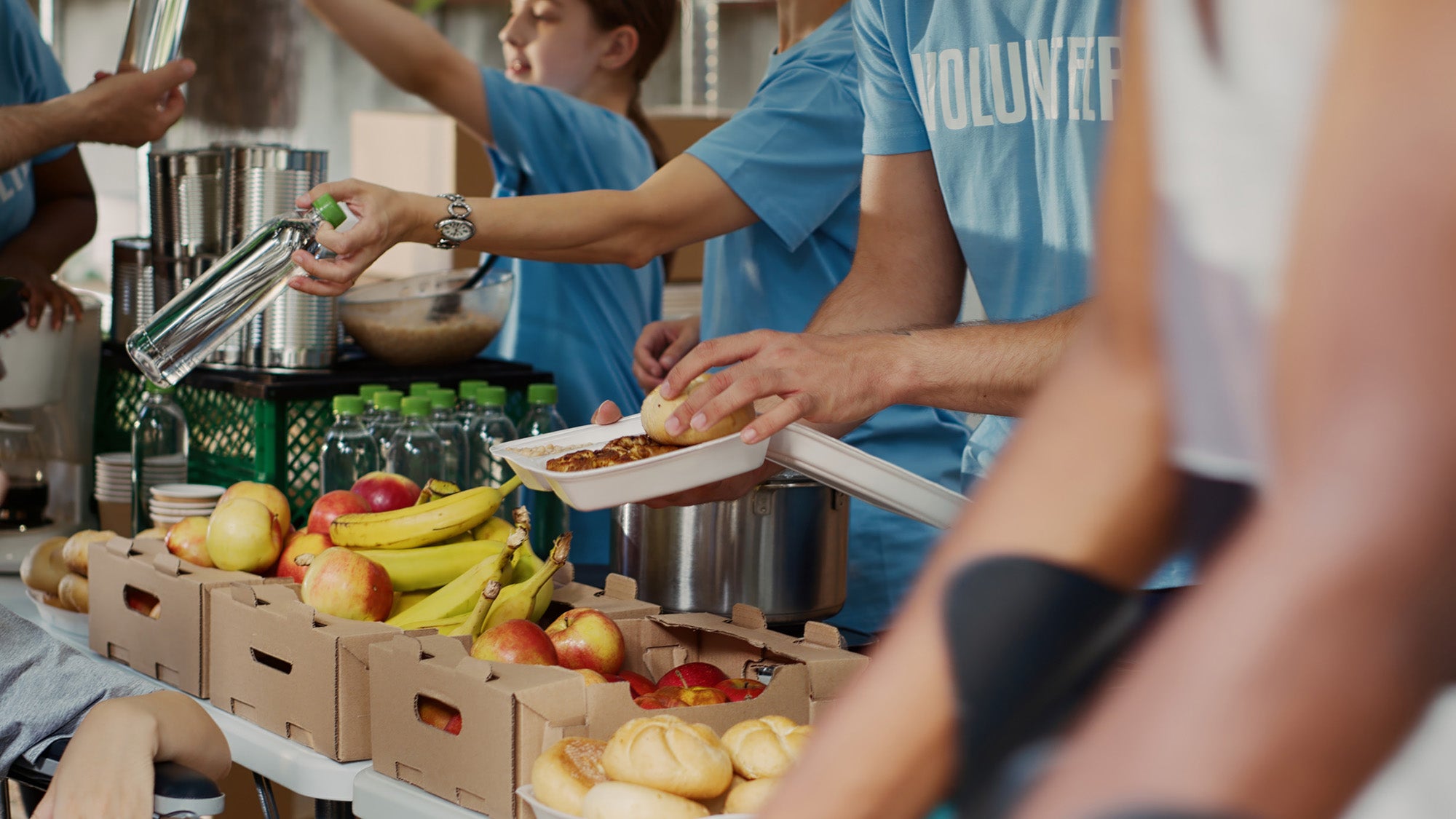 Volunteers giving out food at food bank