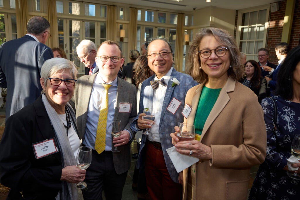 Four guests pose together. 